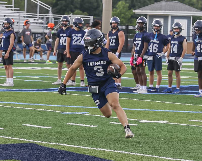 Downers Grove South's Joey Vieyra runs after a catch during the Downers Grove South 7 on 7 football tournament, July 12, 2025  in Downers Grove.