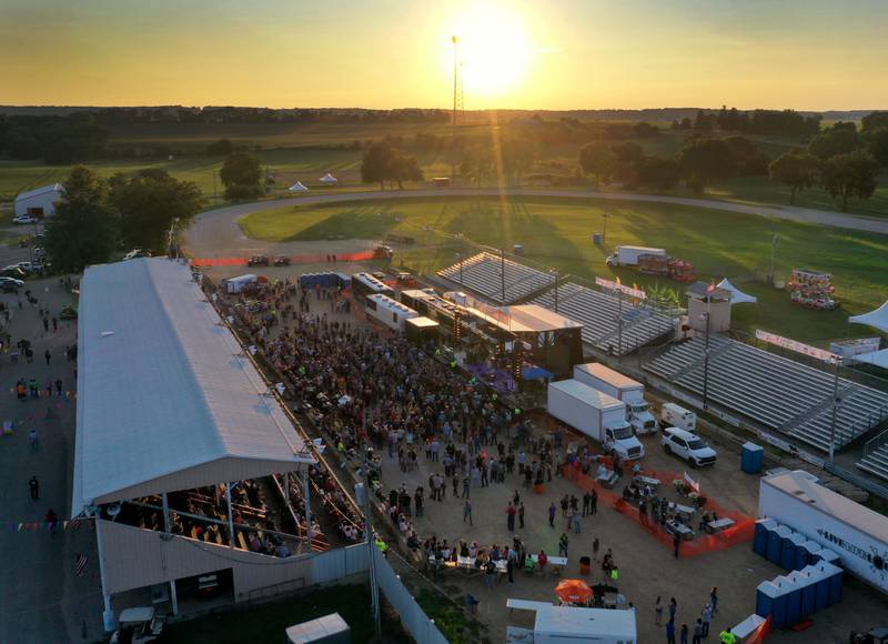 The sun sets during the 103rd annual Marshall-Putnam Fair on Thursday, July 18, 2024 in Henry.