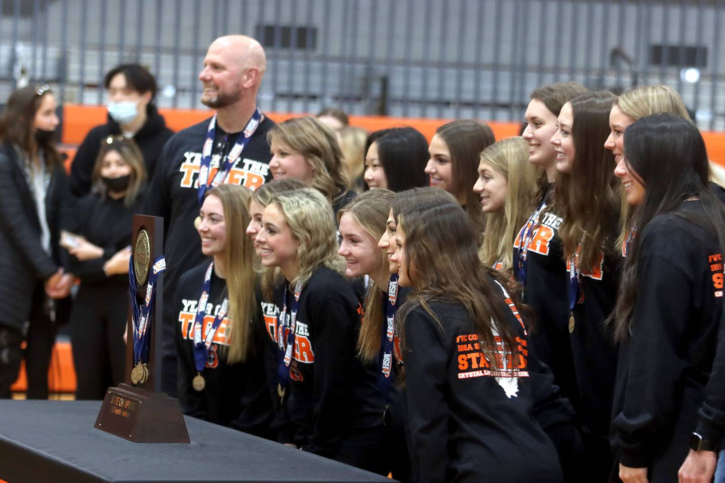 Team members pictured at Grossinger Motors Arena in Bloomington as Crystal Lake Central held a celebration Sunday in the gymnasium after the Tigers won the IHSA state title on Saturday for their competitive cheerleading mediums team. I took