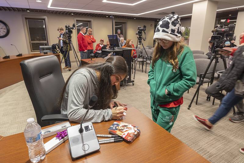 Macie Senders, 9, of Rock Falls gets an autograph Monday, Dec. 23, 2024, from volleyball standout Lexi Rodriguez.