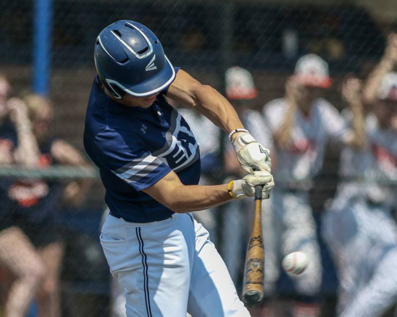 Oswego East's Mike Polubinski (1) connects on a pitch during Class 4A Romeoville Sectional final game between Oswego East at Oswego.  June 3, 2023.