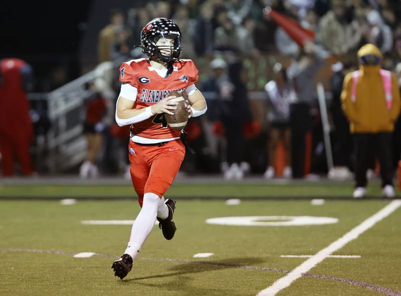 Glenbard East's Michael Nee (4) looks to pass during the varsity football game between Riverside Brookfield and Glenbard East on Friday, Oct. 24, 2025 in Lombard, IL.