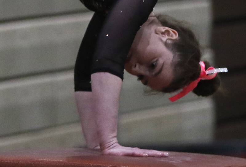 Prairie Ridge’s Delaney Wolfe competes in vault Wednesday, Feb. 8, 2023, during  the IHSA Stevenson Gymnastics Sectional at Stevenson High School in Lincolnshire.