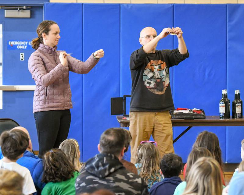 Abby Main of Glen Ellyn helps preform a magic trick with magician Gary Kantor during a performance on Monday Feb. 19, 2024, held at the Main Street Recreation Center in Glen Ellyn.