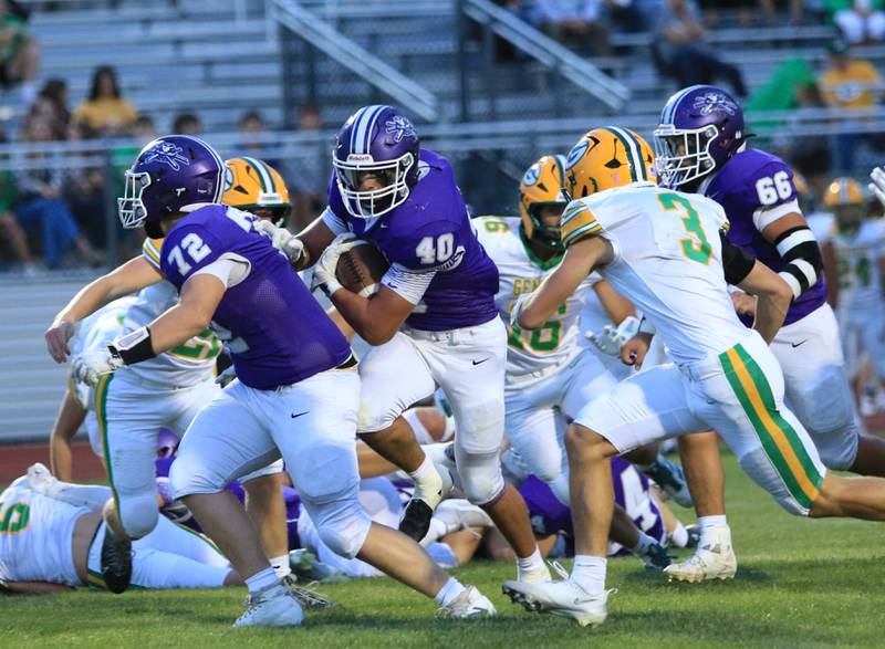 Rochelle's Roman Villalobos (40) rumbles for yardage during their game with Geneseo on Friday, Aug. 29.