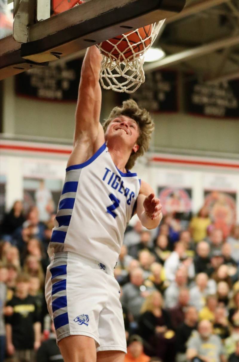 Princeton's Teegan Davis throws down a dunk in the first half of Tuesday's 77-40 sectional win over Riverdale at Orion.