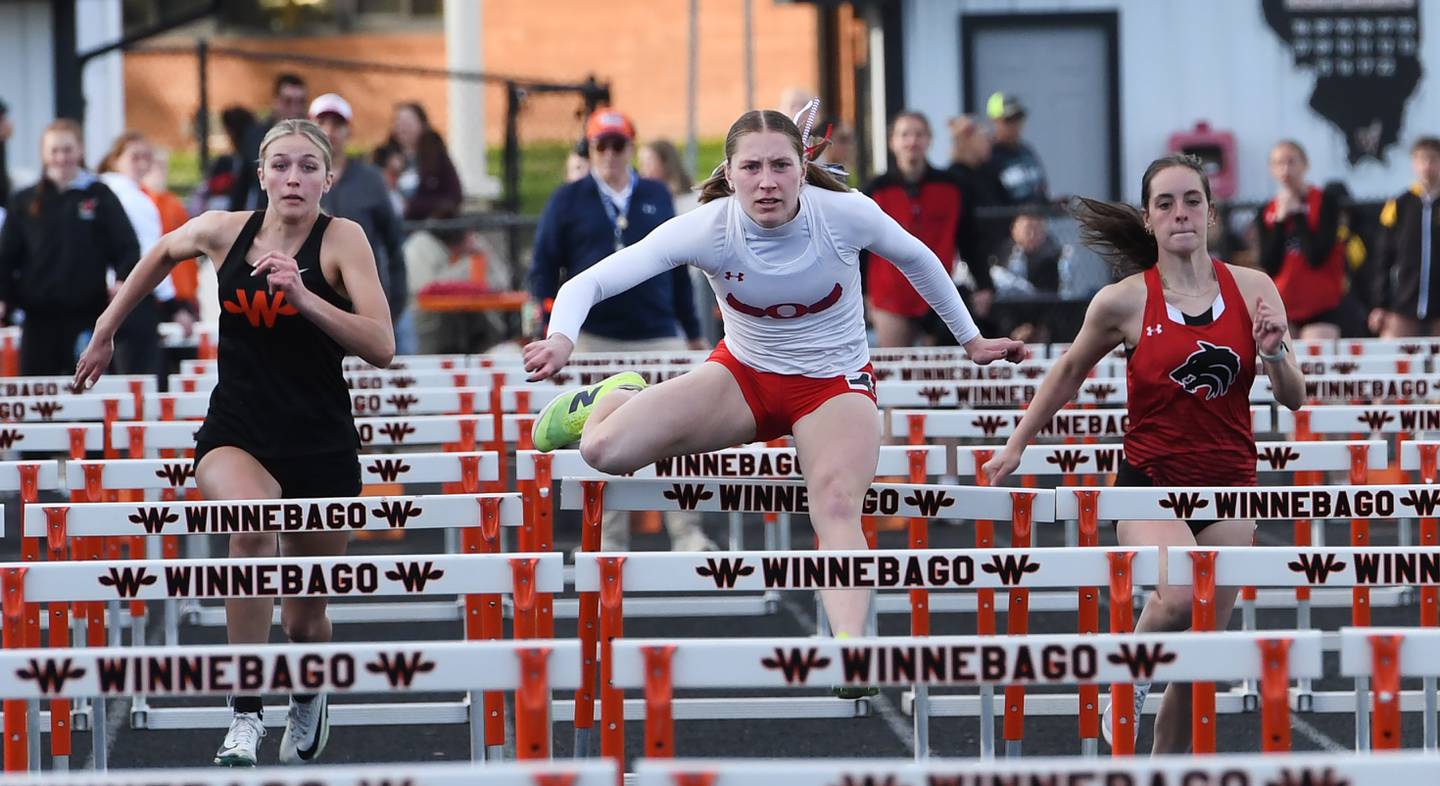 Oregon's Jillian Hammer (center) leads Winnebago's Avery Brule (left) and Indian Creek's Ally Keilman (right) as she heads to the finish line first in the 100 meters hurdles at the 1A Winnebago Sectional on Wednesday, May 13, 2026.
