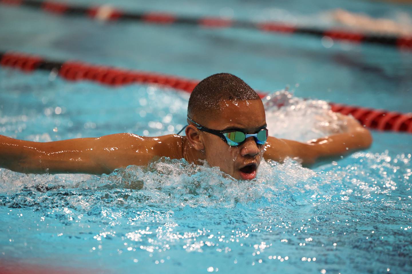 Bishop McNamara's Carter Edwards competes in the 100-yard butterfly race during the All-City meet on Tuesday, Jan. 6, 2026.