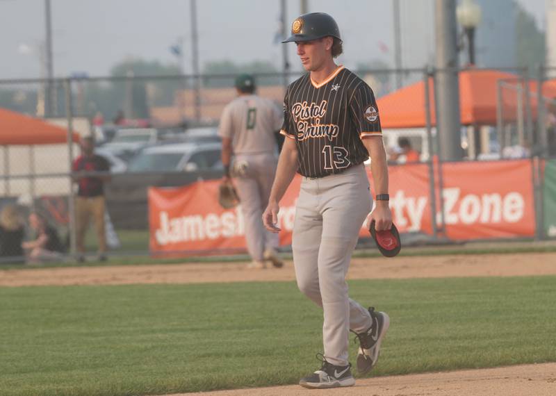 Illinois Valley Pistol Shrimp assistant coach Chance Resetich of Spring Valley, walks back to the dugout while coaching the team against the Alton River Dragons on Thursday, June 5, 2025 at Schweickert Stadium in Peru.