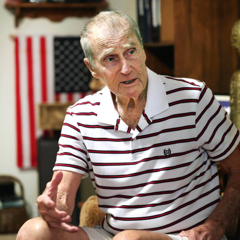 U.S. Army Veteran Jerry Busby talks Wednesday, Aug. 28, 2024, about his time in the service and how it has led to his passion for collecting the military and law enforcement memorabilia that adorn the walls of his DeKalb home.