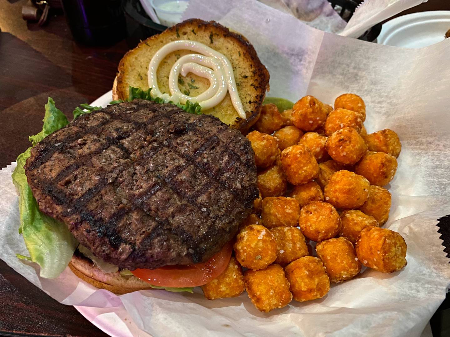 I ordered the Plain Jane burger with sweet potato tots while at Barney’s Beach Club in East Dundee. The 8-ounce burger came with lettuce, tomato, onion, ketchup, mustard and mayonnaise. Cheese was also an option.