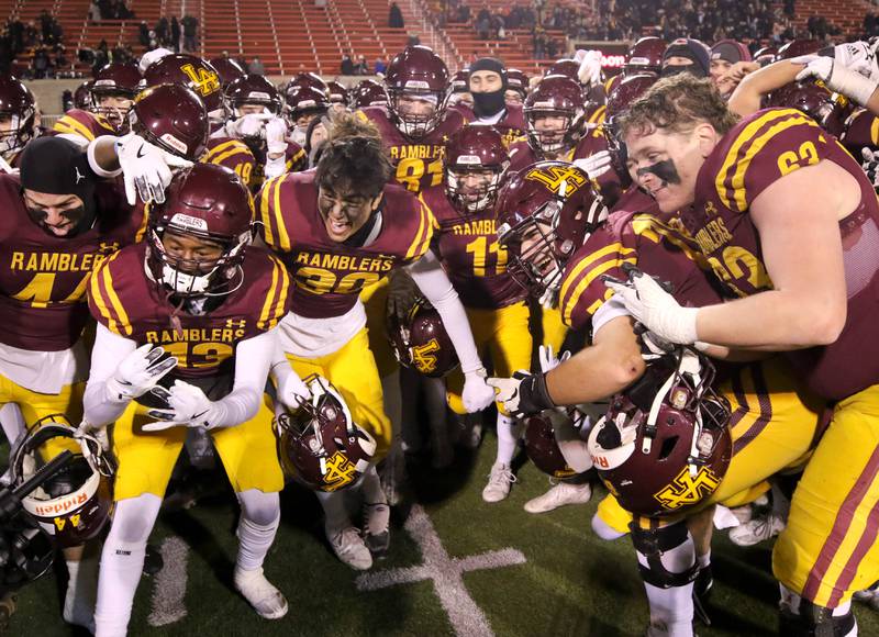 Loyola Academy players celebrate after their Class 8A state championship game win over York Saturday, Nov. 30, 2024, in Hancock Stadium at Illinois State University in Normal.