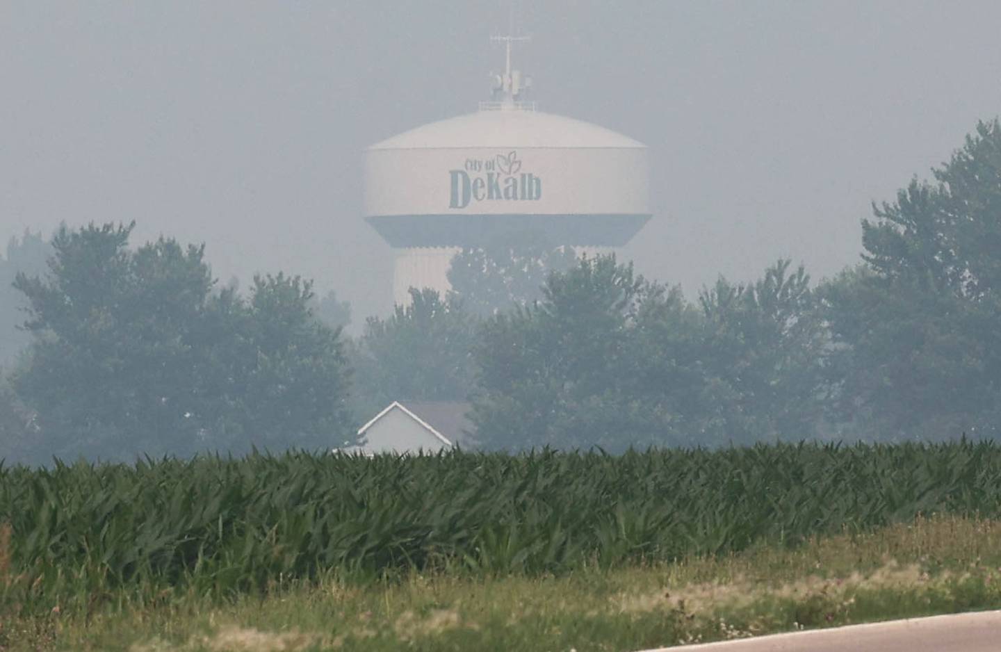 A DeKalb water tower is lost in the haze from the Canadian wildfires Tuesday, June 27, 2023, in DeKalb. Smoke from the fires in Canada has moved south into Illinois causing poor air quality that may be unhealthy especially to those with sensitive respiratory systems.