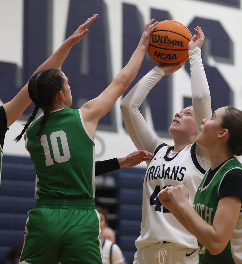 Crystal Lake South's Mallory Glover tries to block the shot of Cary-Grove's Hannah McFaul during a Fox Valley Conference girls basketball game on Tuesday, Dec. 2, 2025, at Cary-Grove High School in Cary.