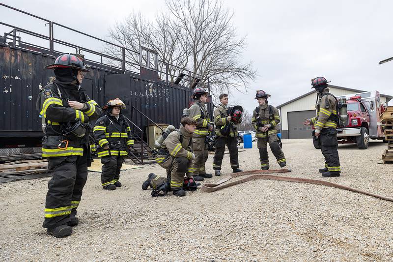 A group of firefighting cadets stage at the training grounds in Amboy Saturday, March 15, 2025. The 16 cadets are in their final weekend of training for the program that hopes to bolster volunteer firefighting numbers.