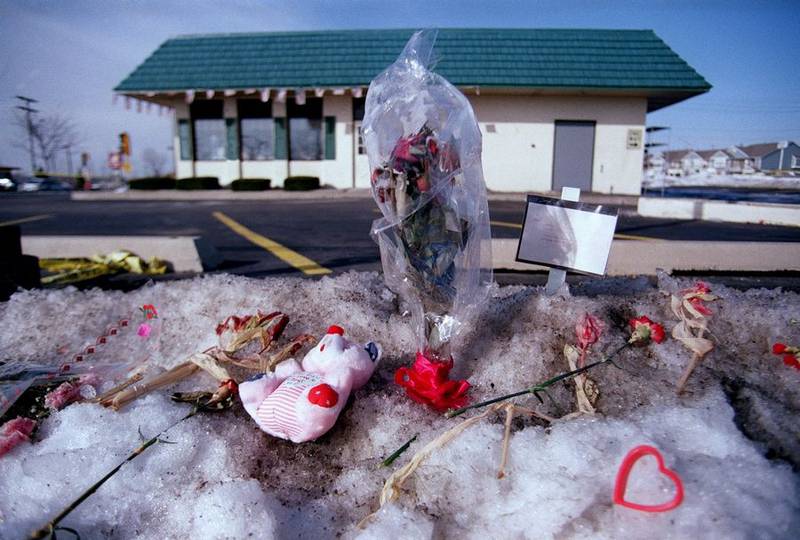 Memorials including flowers, signs, hearts and stuffed teddy bears were placed outside the Brown's Chicken in Palatine after seven people were murdered there on Jan. 8, 1993.