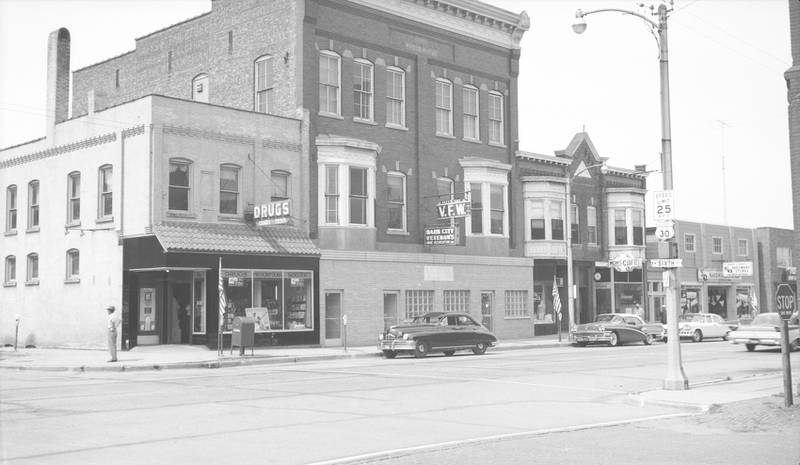 Looking at the southwest side of the street from the north side of 6th Street and Lincoln Highway in DeKalb, July 1959.