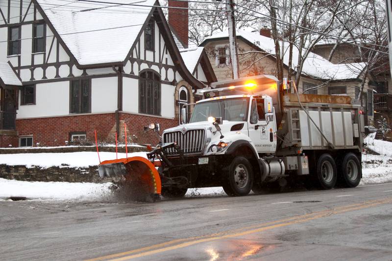 A St. Charles snow plow clears a city street after an overnight snowfall on Tuesday, Jan. 9, 2024.