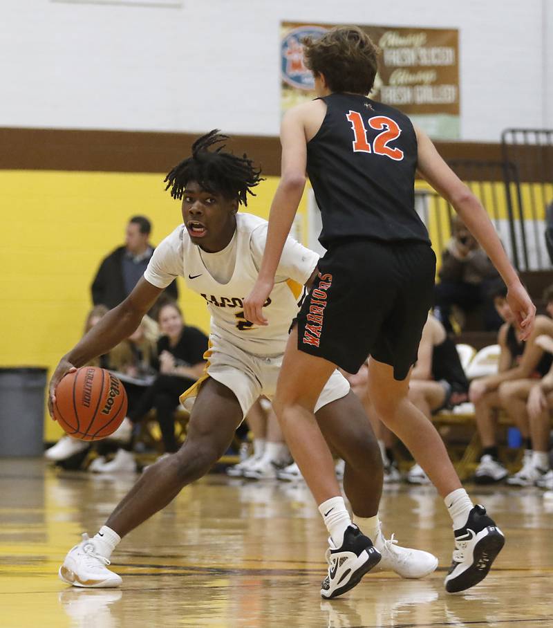 Jacobs' Treval Howard brings the ball up the court against McHenry's Caleb Jett during a Fox Valley Conference basketball game Wednesday, Dec. 7, 2022, between Jacobs and McHenry at Jacobs High School in Algonquin.