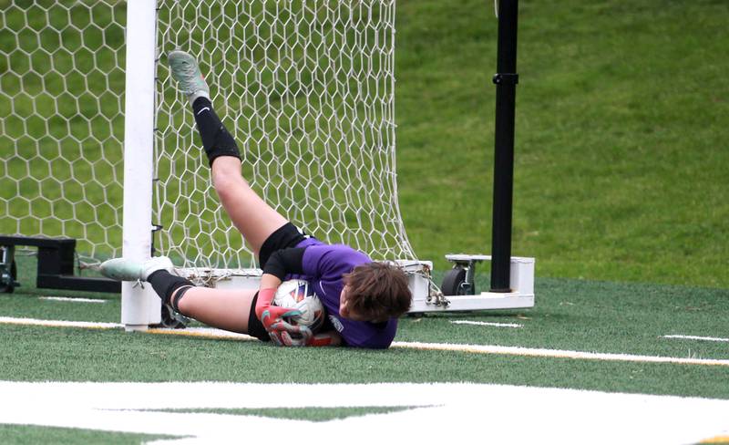 Glenbard West's Giuliana Rossi makes a save during a Class 3A Glenbard West Sectional semifinal game against Wheaton Warrenville South on Tuesday, May 27, 2025 in Glen Ellyn.