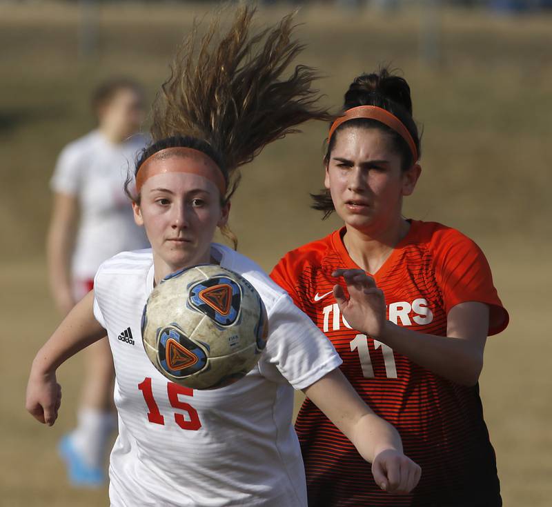 Marian Central's Angelina Cutrona tries to control the ball in front of Crystal Lake Central's Kaitlin Gaunaurd during a non-conference soccer match Monday, March 21, 2022, between Crystal Lake Central and Marian Central at Crystal Lake Central High School.