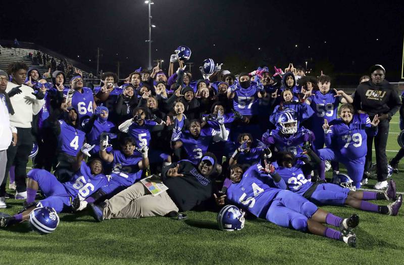 Larkin football players celebrate their win during the annual crosstown rival game at Memorial Field  Friday October 14, 2022 in Elgin.