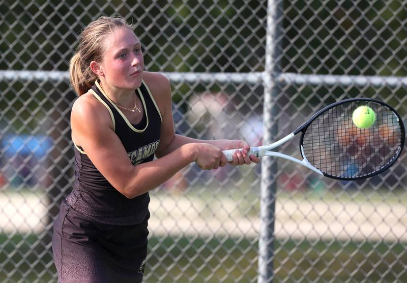 Sycamore’s Morgan Cook hits a backhand during her match against DeKalb Wednesday, Sept. 18, 2024, at Sycamore High School.