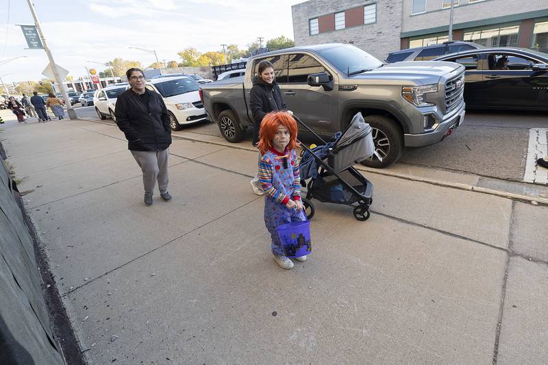 Alexzander Hall, 5, hits the streets of Rock Falls Friday, Oct. 25, 2024, dressed as Chucky for the Biz Boo Trick or Treat event in the downtown.
