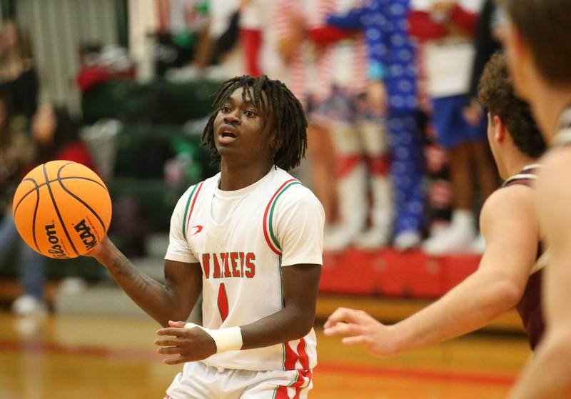 L-P's Cordell Wheatley looks to pass the ball off around Morris defenders on Friday, Dec. 6, 2024 in Sellett Gymnasium at L-P High School.