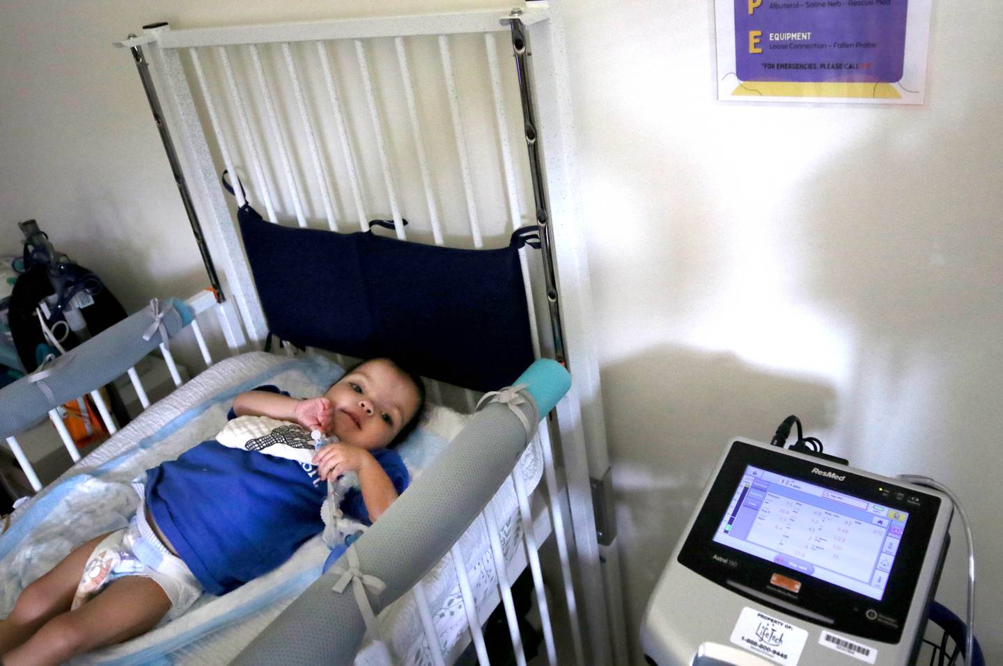 Marely Chavarria Santos, 1, is hooked up to various monitors Monday, June 30, 2025, that track her vitals at their home in DeKalb. Marely was born with a myriad of health issues that require around-the-clock care and recently received a heart transplant.