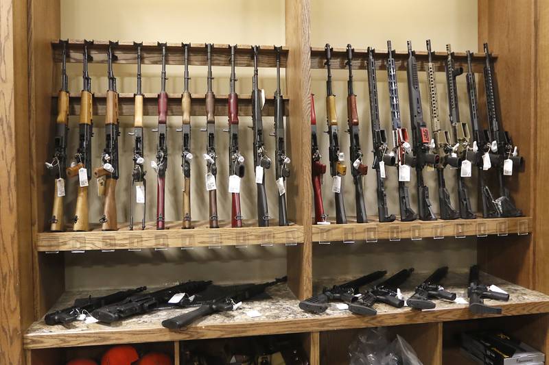 Guns for sale at Second Amendment Sports, in McHenry, on Thursday, Dec. 1, 2022. Democrats  in the state Legislature unveiled a plan that would immediately outlaw the sale of assault weapons and prevent most residents under 21 from legally buying a gun.