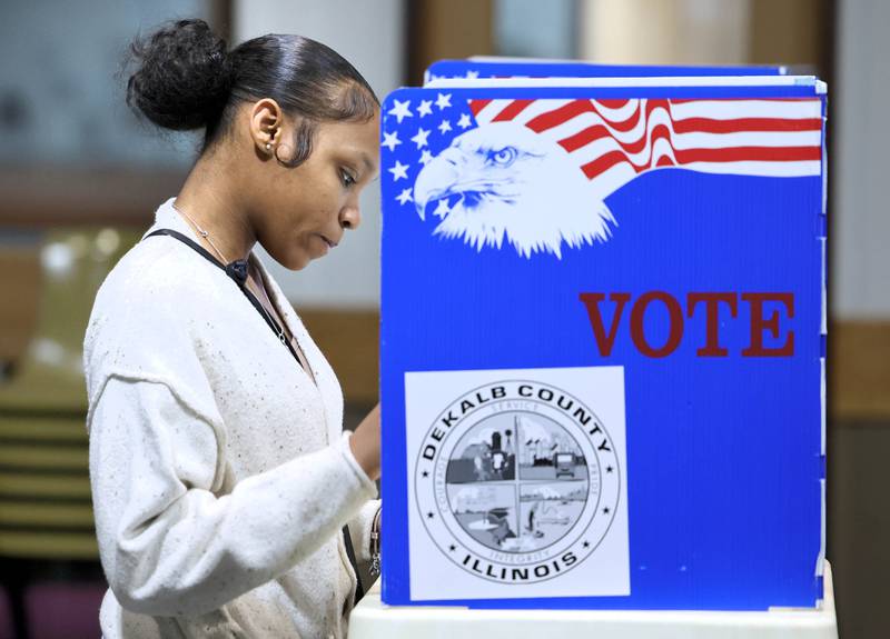 Arianna Chandler, a senior at Northern Illinois University, casts her ballot on Election Day, Tuesday, Nov. 8, 2022, at the polling place in Westminster Presbyterian Church in DeKalb.