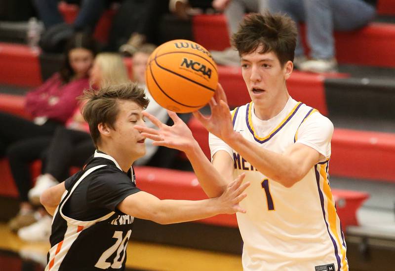 Mendota's Cole Tillman passes the ball off as Kewanee's Griffin Hicks defends during the 50th annual Colmone Classic on Thursday, Dec. 12, 2024 at Hall High School.
