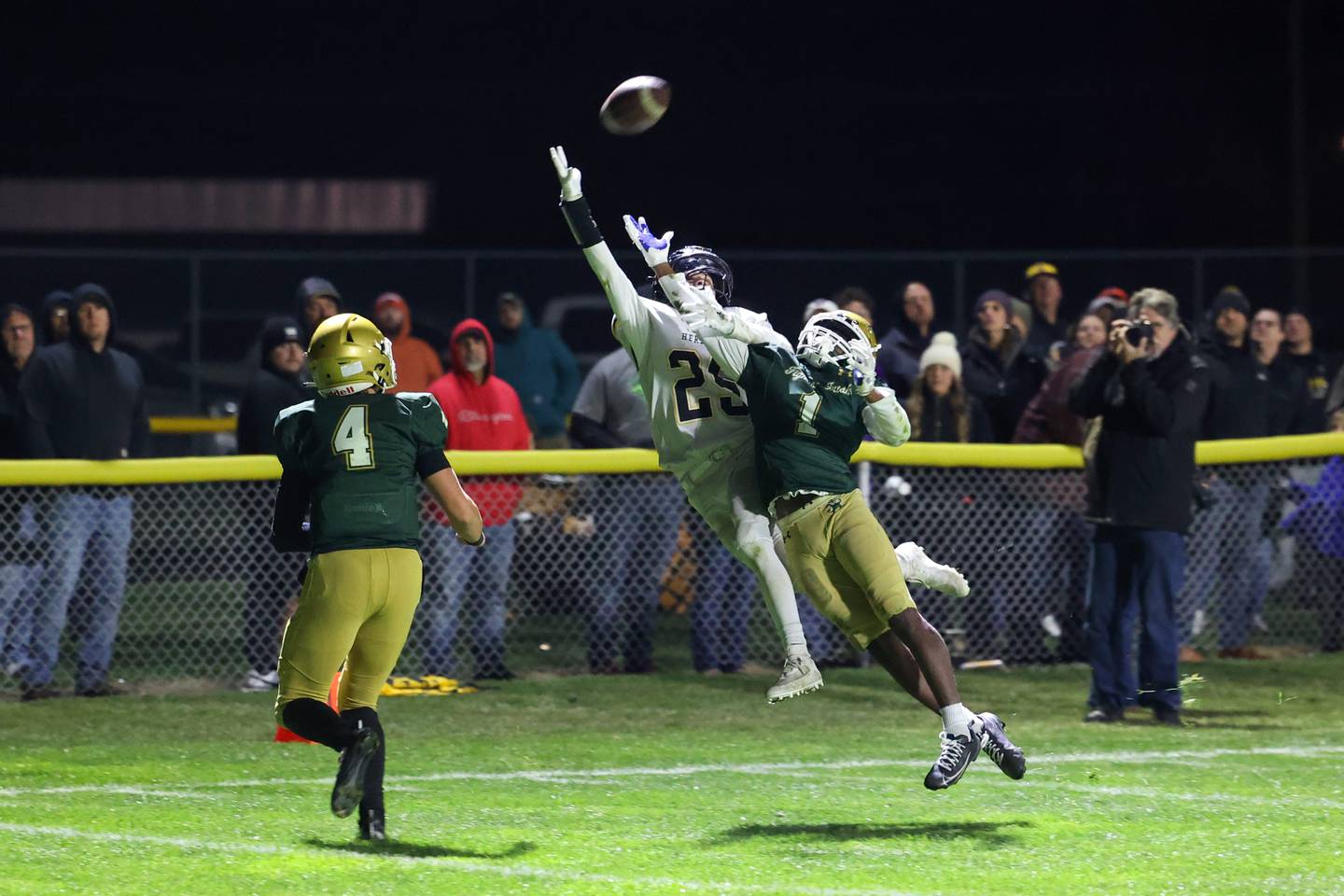 Bishop McNamara's Malachai Lee defends a pass to Herscher's Mason Roberts in the end zone during Bishop McNamara's 38-14 victory in the IHSA Class 3A first round playoff game on Friday, Oct. 31, 2025.
