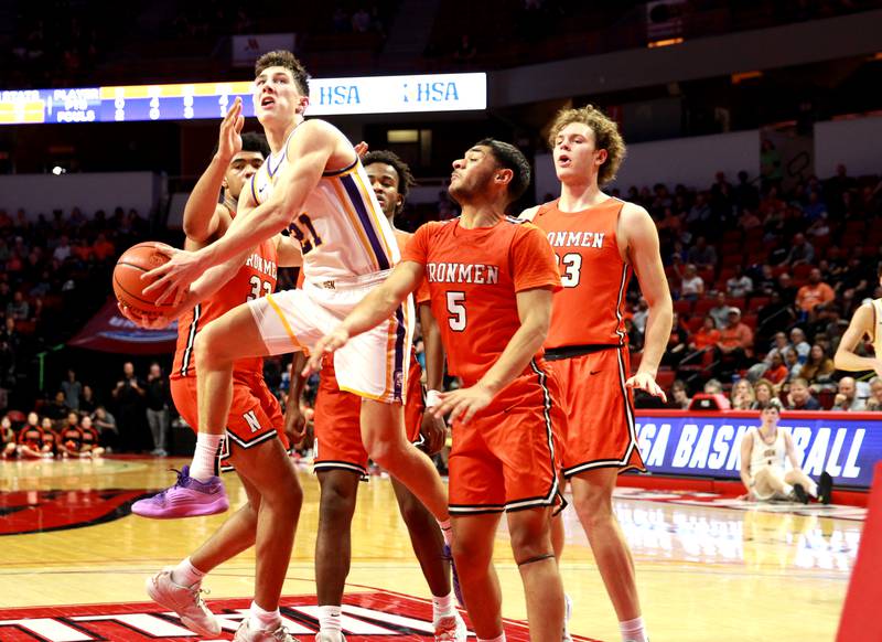 Downers Grove North’s Jack Stanton goes up for a shot during the Class 4A Normal Supersectional game against Normal Community on Monday, March 4, 2024.