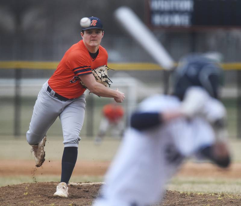 Naperville North pitcher Harrison Cordeiro throws to an Oswego East batter during Wednesday's baseball game in Naperville.