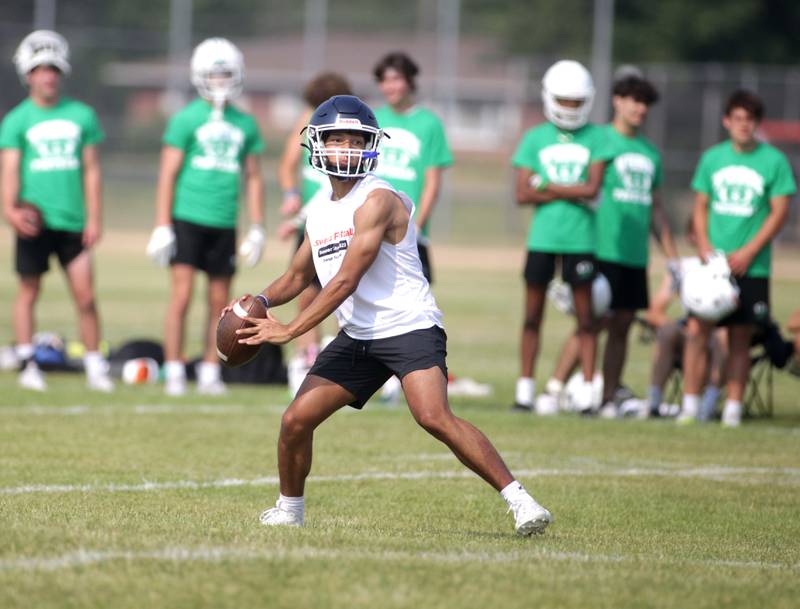 Oswego’s Grant Zegar throws the ball during a 7-on-7 football tournament at West Aurora High School on Friday, June 23, 2023.