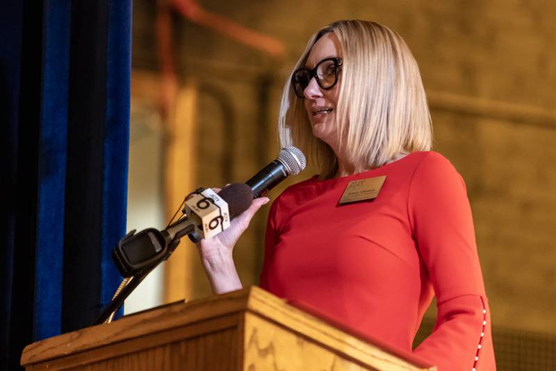 Kristine Schlismann shares remarks about veterans from the community during the Veterans Day Assembly at Joliet Central High School on Nov. 7, 2025.