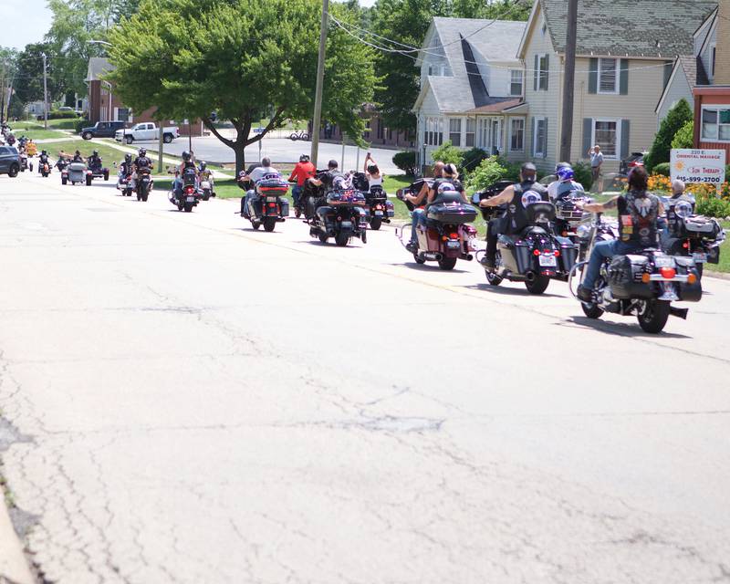 Motorcycle riders leave from Sycamore Public Library for a "Rally for Oliver," a parade meant to support Sycamore 2-year-old Oliver Olinger, who was joined by his family on Sunday, June 22, 2025, escorted by first responders to the St. Charles Motorcycle Museum.