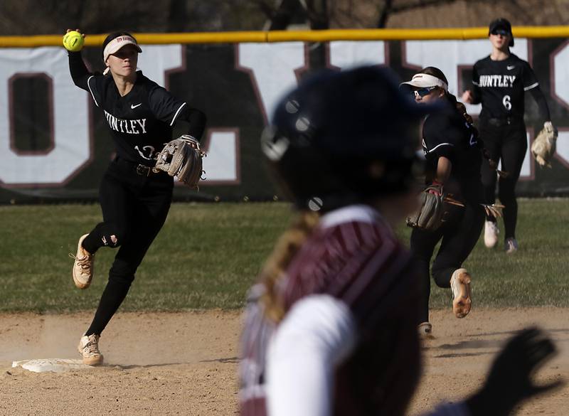 Huntley's Aubrina Adamik throws to first base to get out Prairie Ridge's M-K Center as she turns a double play during Fox Valley Conference softball game on Monday, April 14, 2025, at Prairie Ridge High School in Crystal Lake.