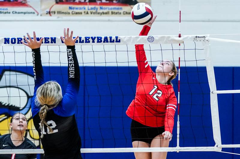 Aurora Christian's Katie Maddox (12) goes up for a kill against Newark during a non-conference match at Newark High School on Tuesday, Sept. 9, 2025.