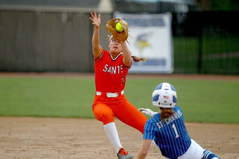 St. Charles East's Addison Wolf attempts to get St. Charles North's Ella Heimbuch out at second base during a game on Friday, April 25, 2025 at St. Charles North.