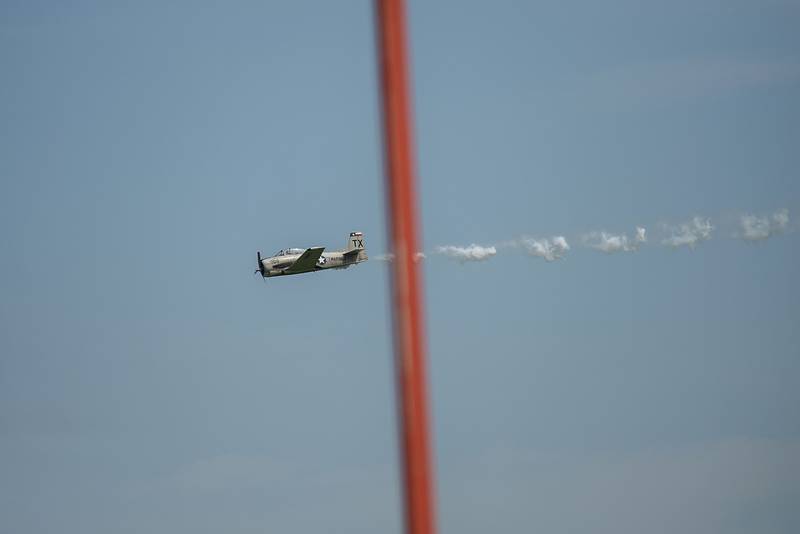A member of the Trojan Phlyers team soars over the Whiteside County Airport Saturday, July 23, 2022 in Rock Falls. Many of the pilots will be heading to the large airshow in Oshkosh after the weekend.