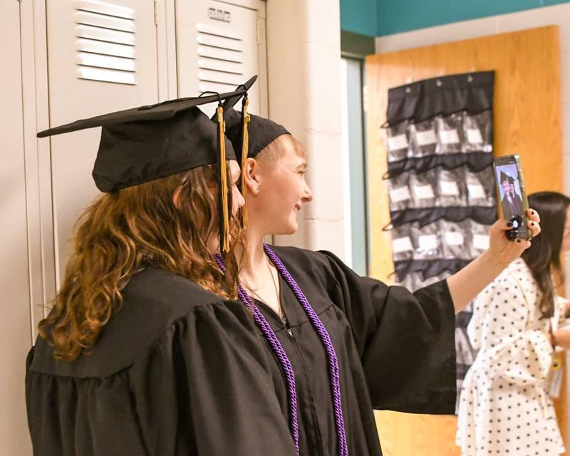 Sycamore graduates Heather Salis and Logan Franz take a selfie before the start of the Class of 2026 Commencement on Sunday, May 24, 2026, held at Sycamore High School.