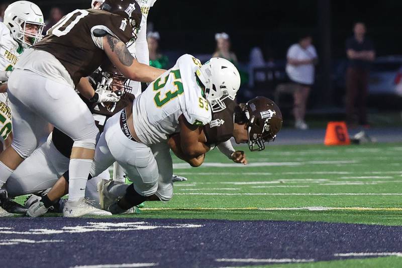 Providence’s Byron Olson sacks Joliet Catholic’s Andres Munoz on Friday, Sept. 1, 2023 Joliet Memorial Stadium.