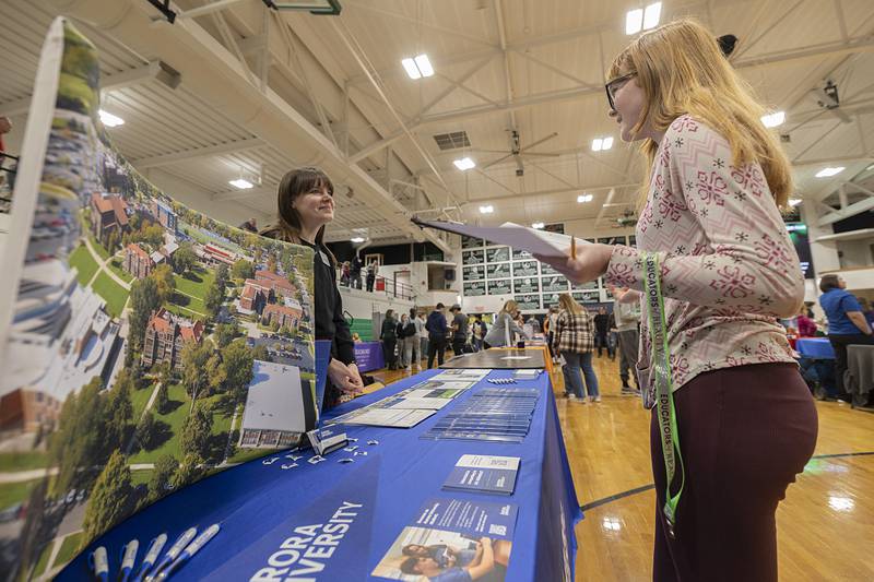 Katie Lentz, Freshman Administration Counselor for Aurora University, speaks with Rock Falls High School freshman Heidi Epps Thursday, Feb. 12, 2026, during the school’s career fair.