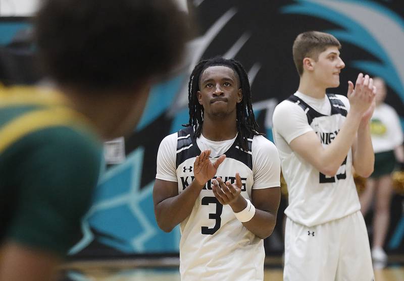 Kaneland's Marshawn Cocroft and Kaneland's Connor Kimme clap as they celebrate their win as the clock runs out during the IHSA Class 3A Woodstock North Sectional final basketball game against Crystal Lake South on Friday, March 6, 2026, at Woodstock North High School.