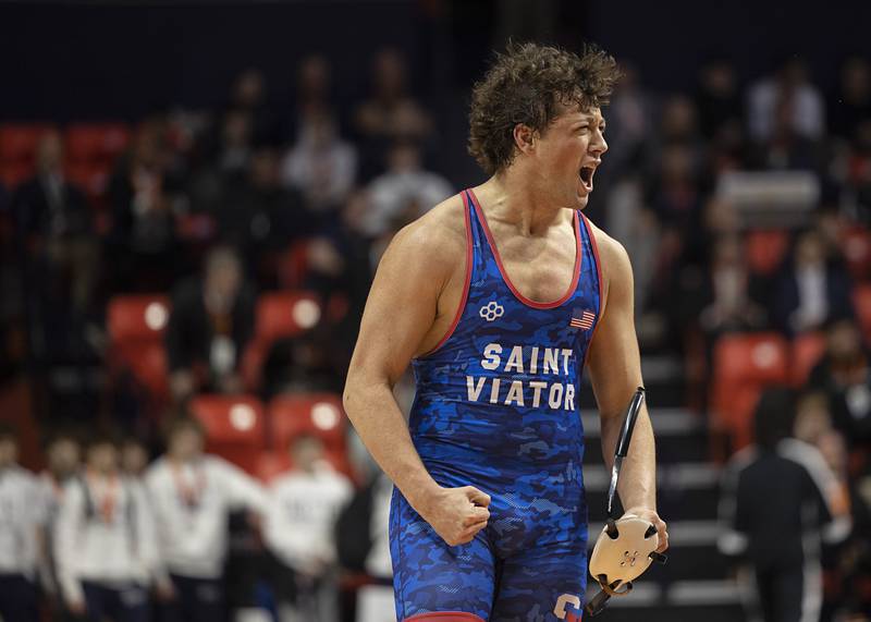 St. Viator’s Jaxon Penovich celebrates winning the 190 pound title Saturday, Feb. 21, 2026, at the IHSA wrestling finals in Champaign.