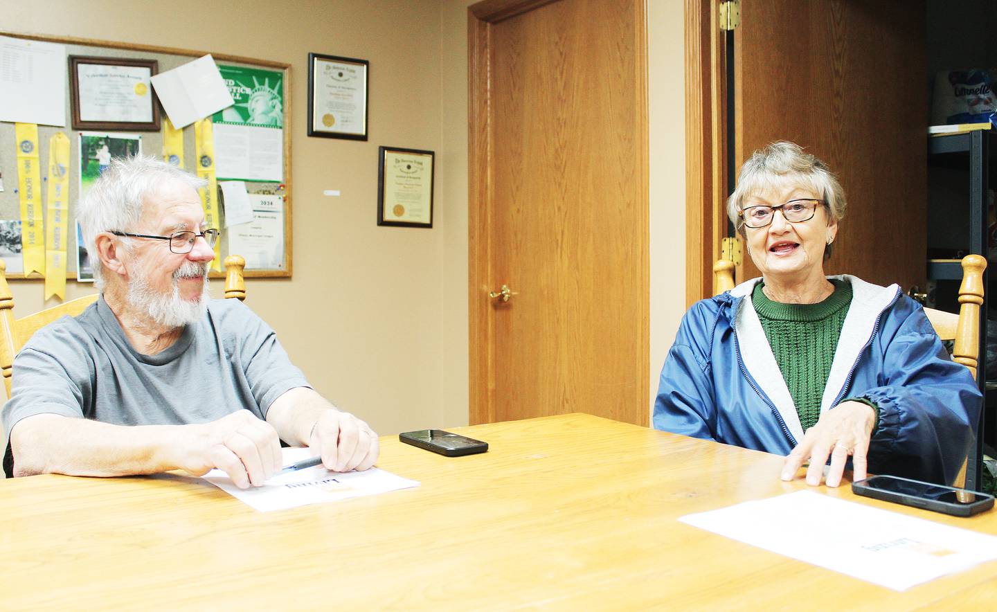 Compton fire chief Steve Gilmore, a lifelong Compton resident, and The Village House of Praise co-pastor Neva Ikeler of Paw Paw share memories of Compton and this summer's sesquicentennial celebration during a Nov. 30, 2025 meeting at the Village Hall.