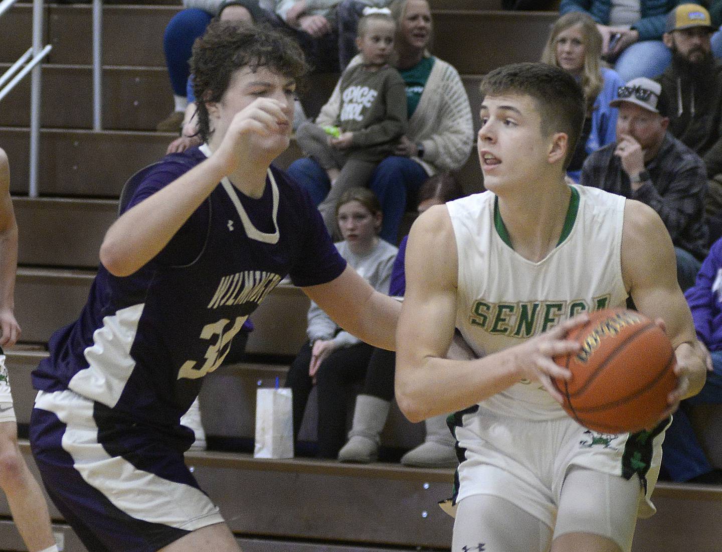 Seneca’s Lane Provance looks for a pass outlet as Wilmington’s Joey Cortese guards the lane  in the 4th period on Saturday, Feb. 4, 2023 at Seneca.